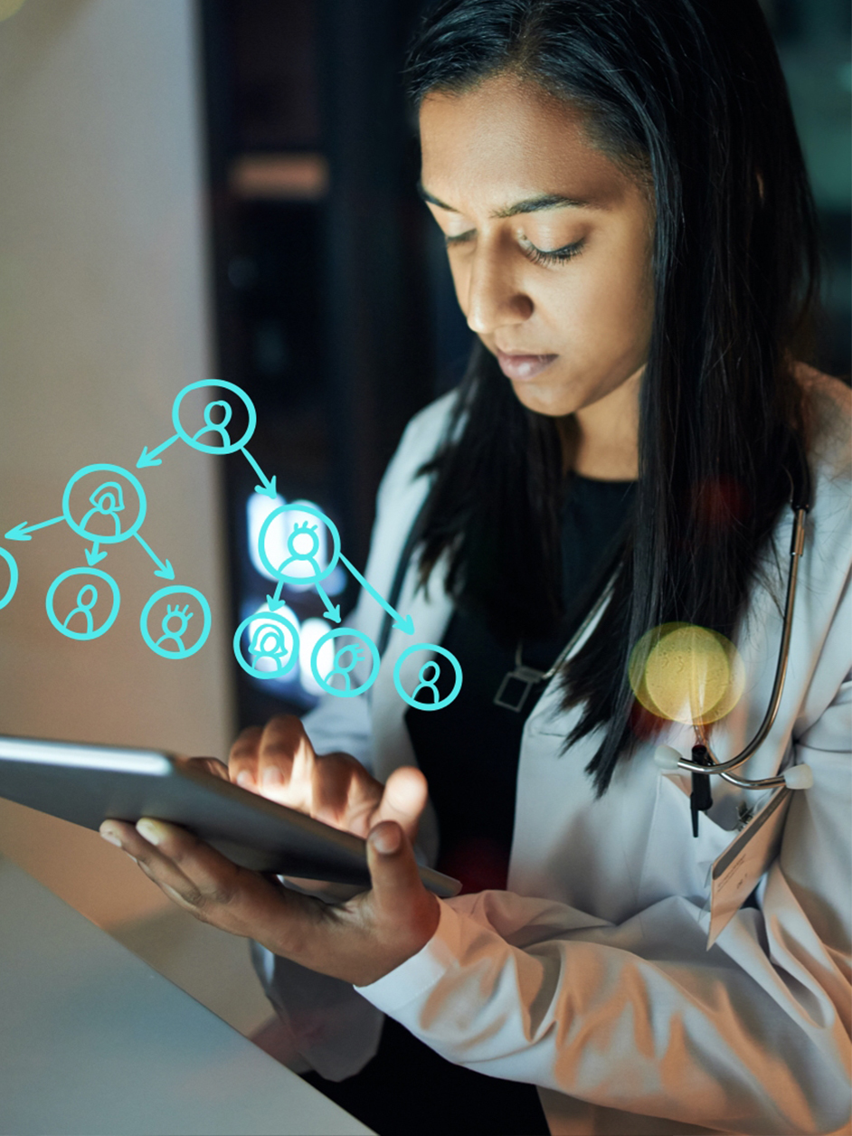 Woman on tablet in doctor jacket