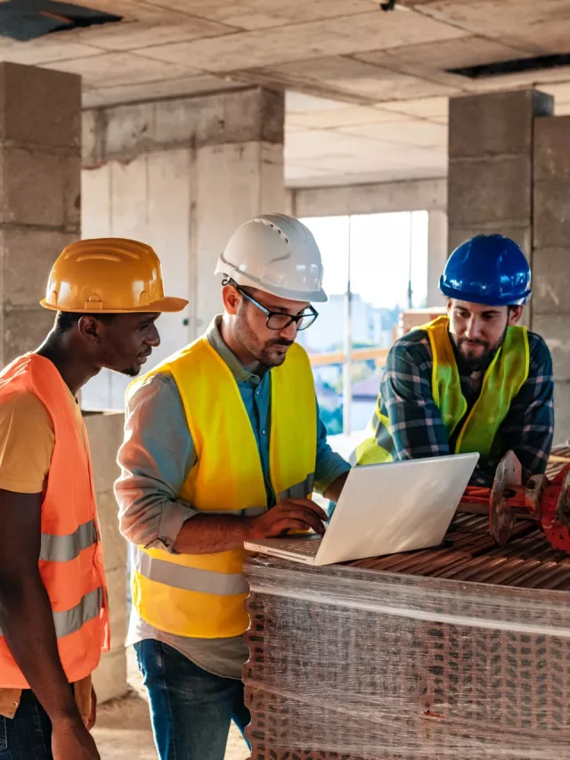 construction team using laptop